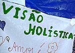 Parte de cartaz, escrito "visão holística"