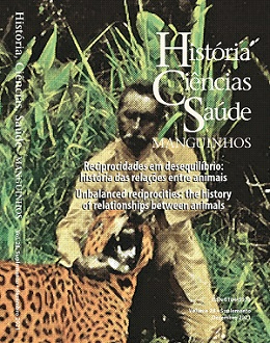 Capa da revista mostra um pesquisador de pé abrindo a boca de um tigre